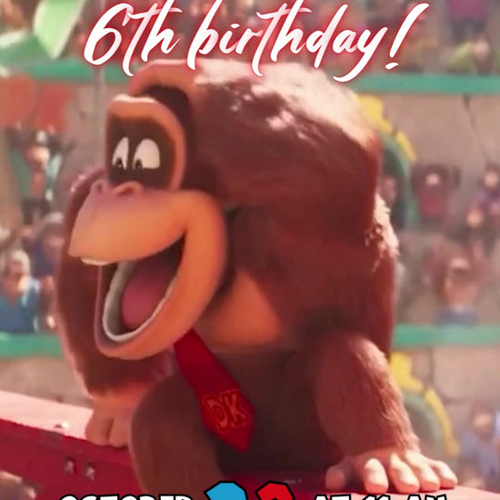 Donkey Kong wearing a red DK tie on red arena girders above a cheering crowd, with multicolor name lettering and bright birthday details.