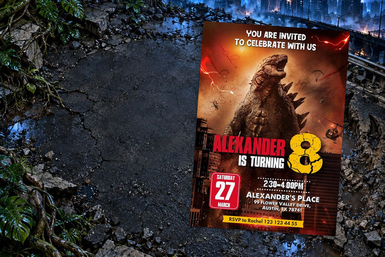 Godzilla & Kong birthday invitation on a Godzilla & Kong themed party table